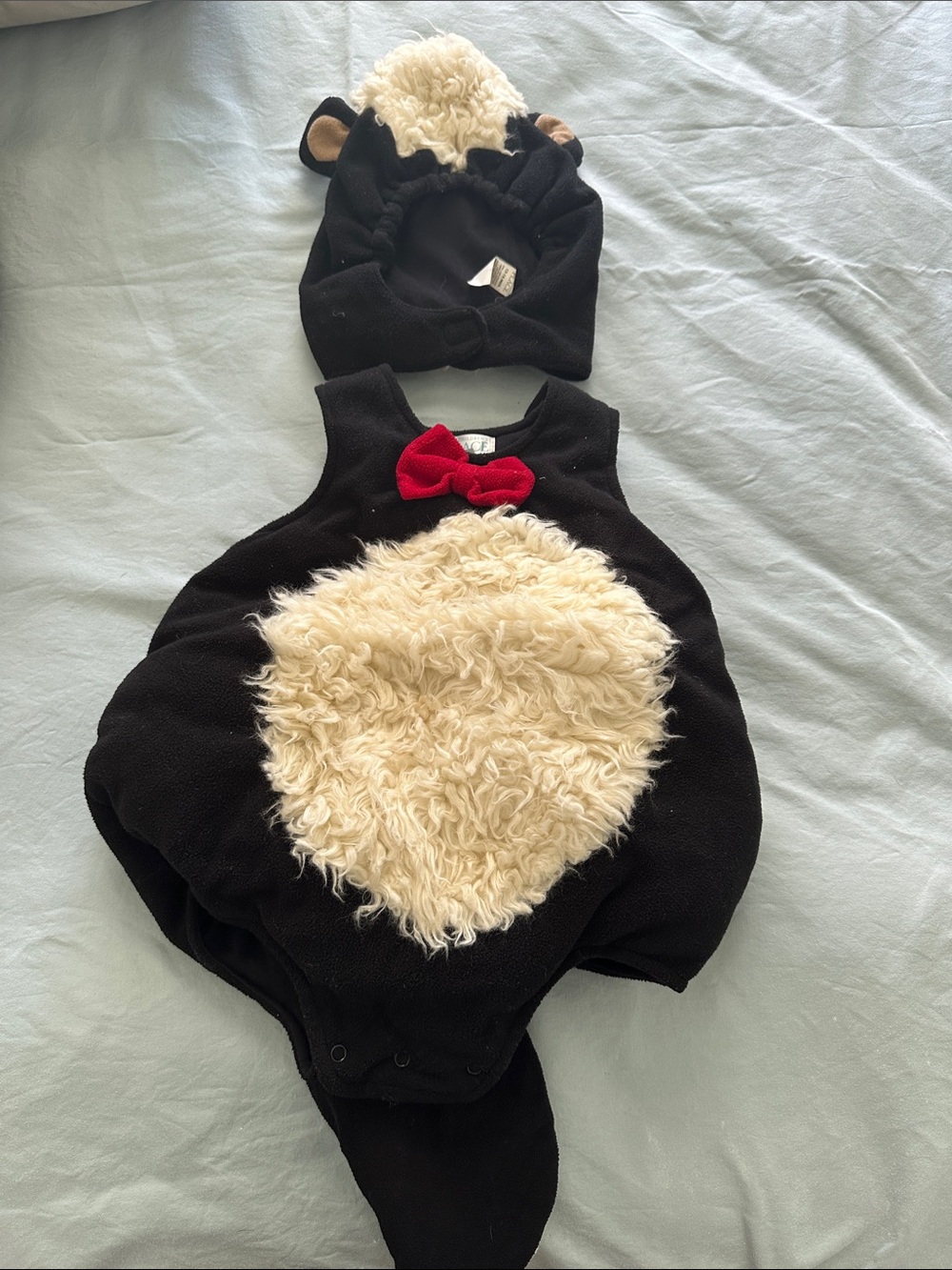 The Children's Place Black Plush Animal Romper with Cream Belly and Red Bow